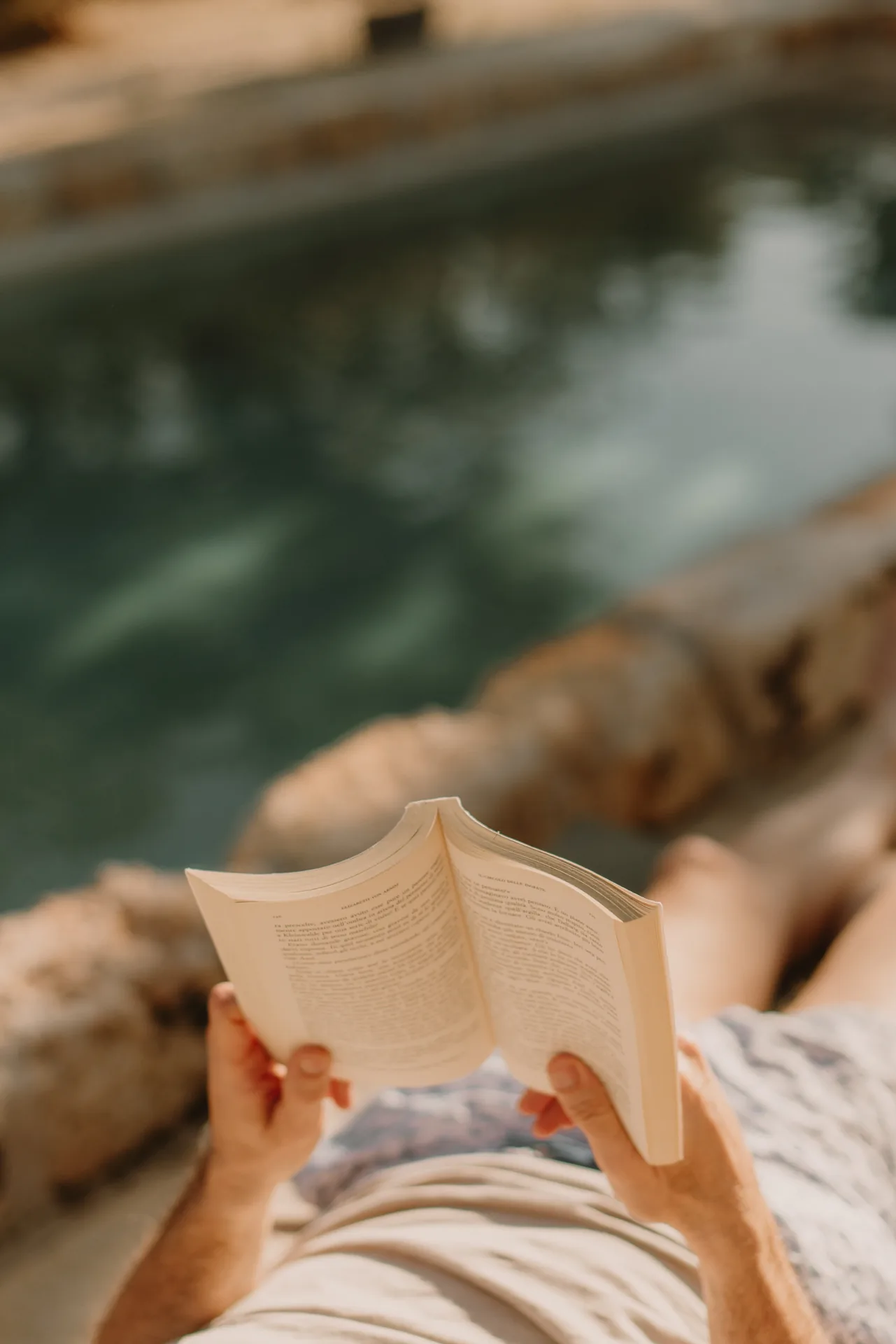 Reading at the edge of the pool