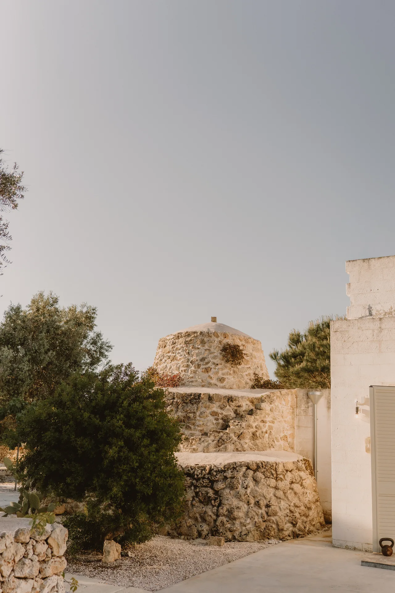 The trullo and the house seen from the garden